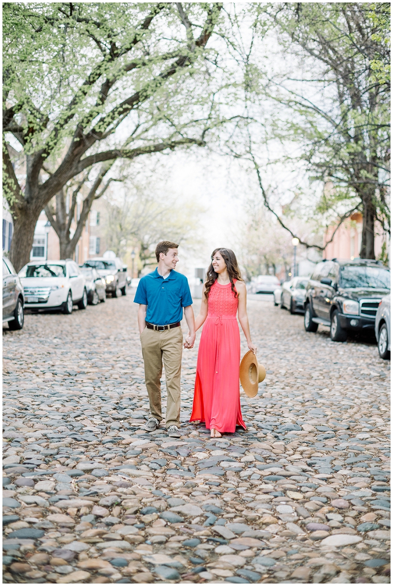 Old Town Alexandria | Spring engagement on cobblestone street with sunhat